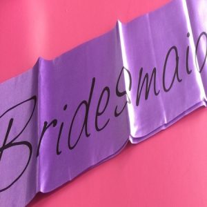 We Like To Party Bridesmaid Purple Sash With Black Writing