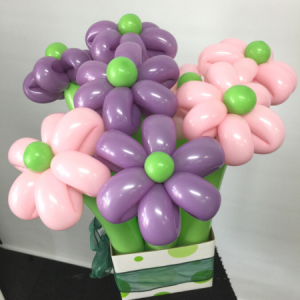We Like To Party Balloon Flower Box trimmed with ribbon
